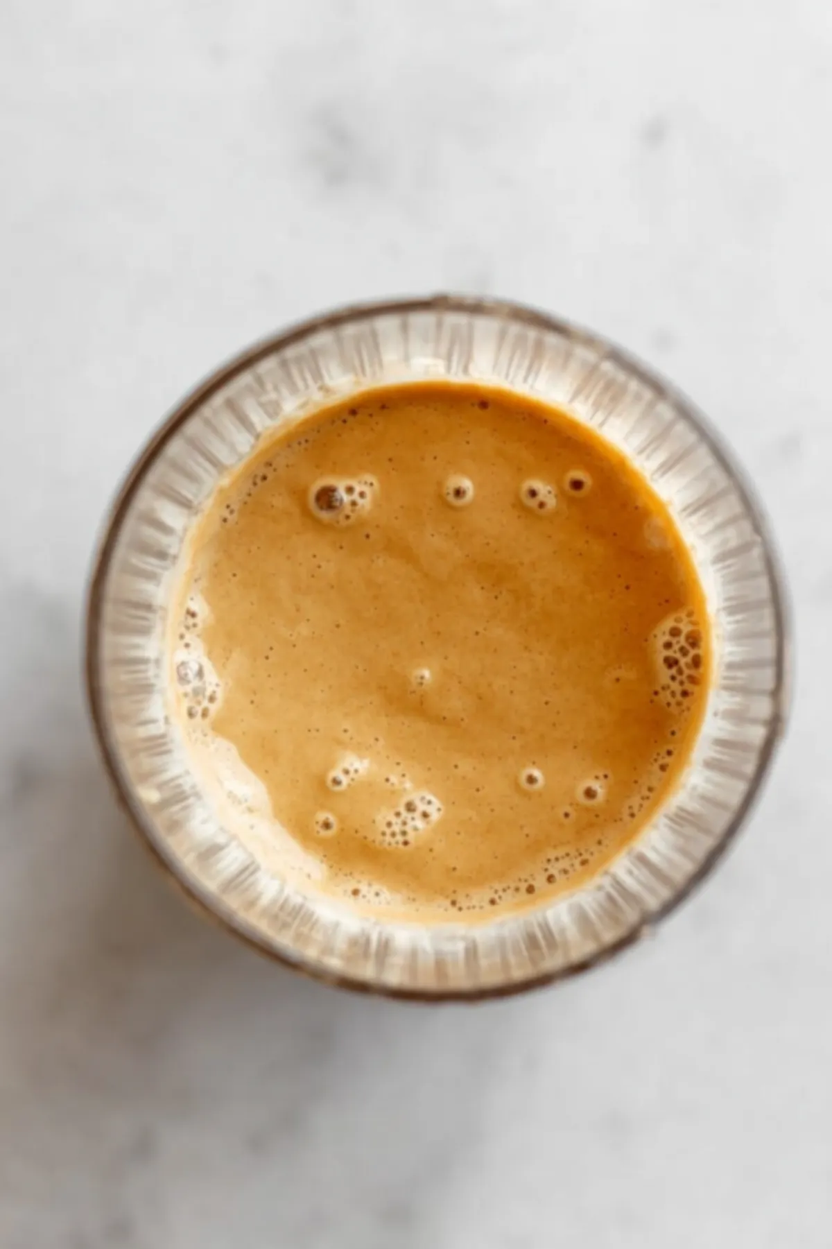 Blended pancake batter in a clear blender cup